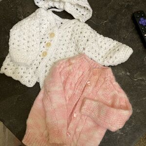 Crochet baby cardigans set of two. White hood, white and pink cardigan.
